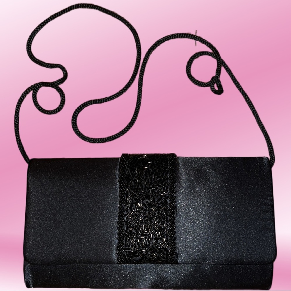 Black woman’s clutch with beaded design on front and long shoulder strap